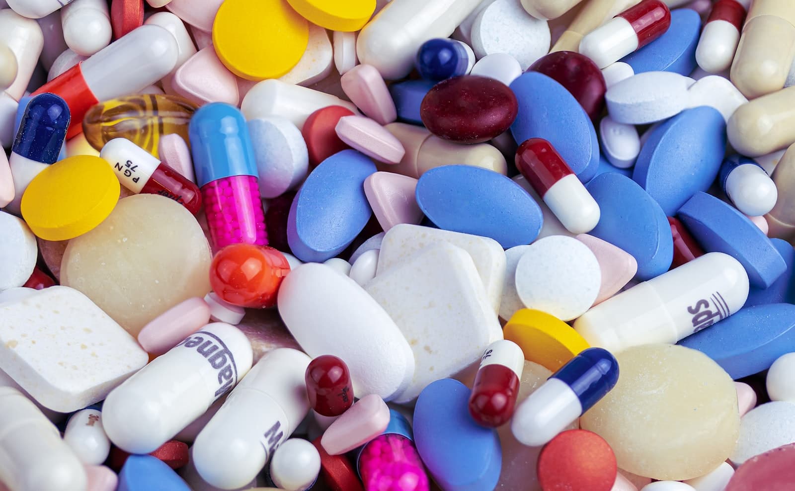 A close-up of assorted pharmaceutical capsules